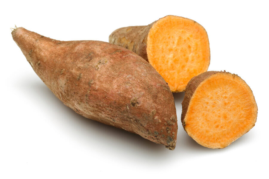 Raw sweet potato with slice isolated on white Produce