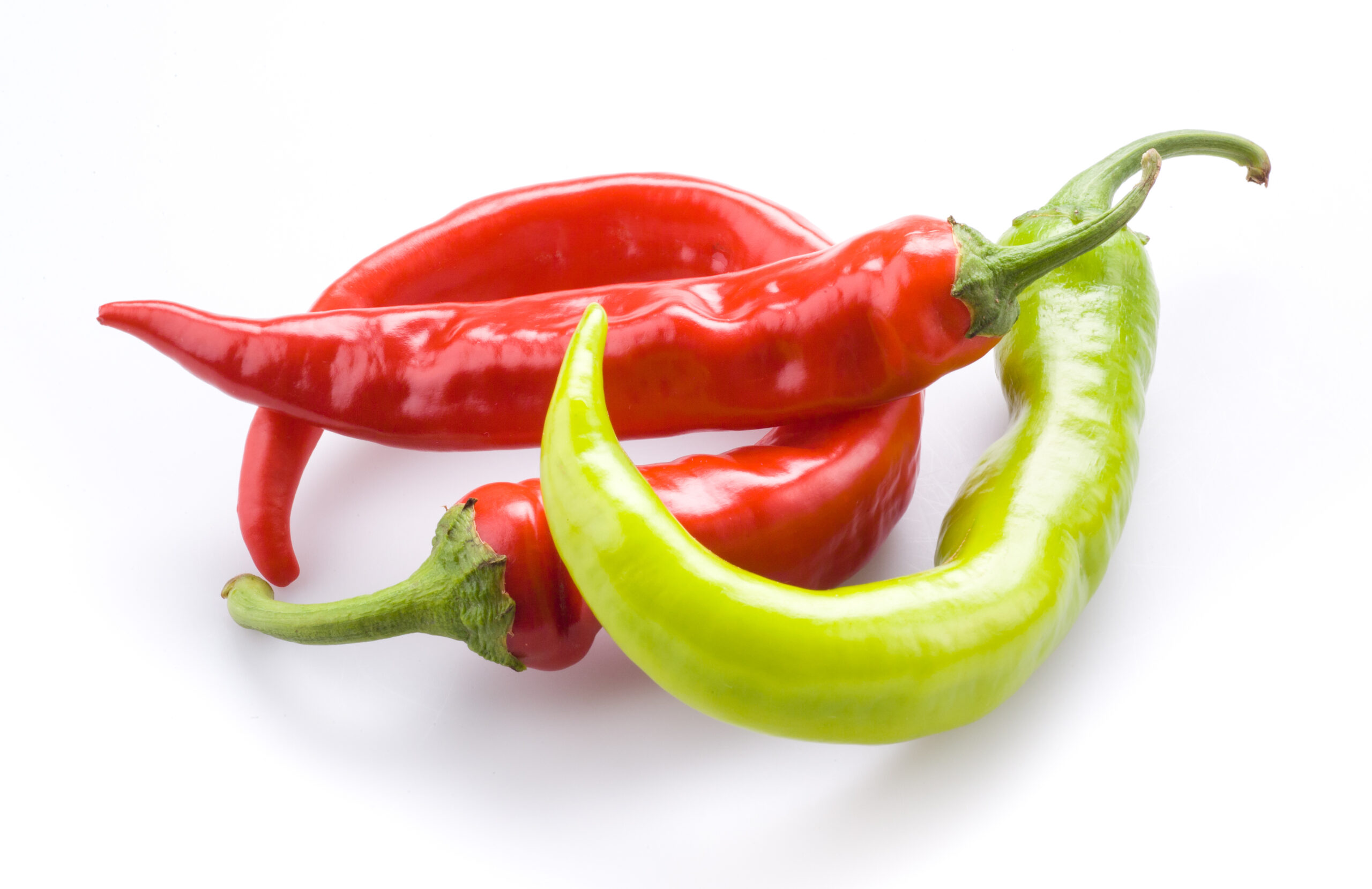 Three hot chili peppers isolated on a white background Produce